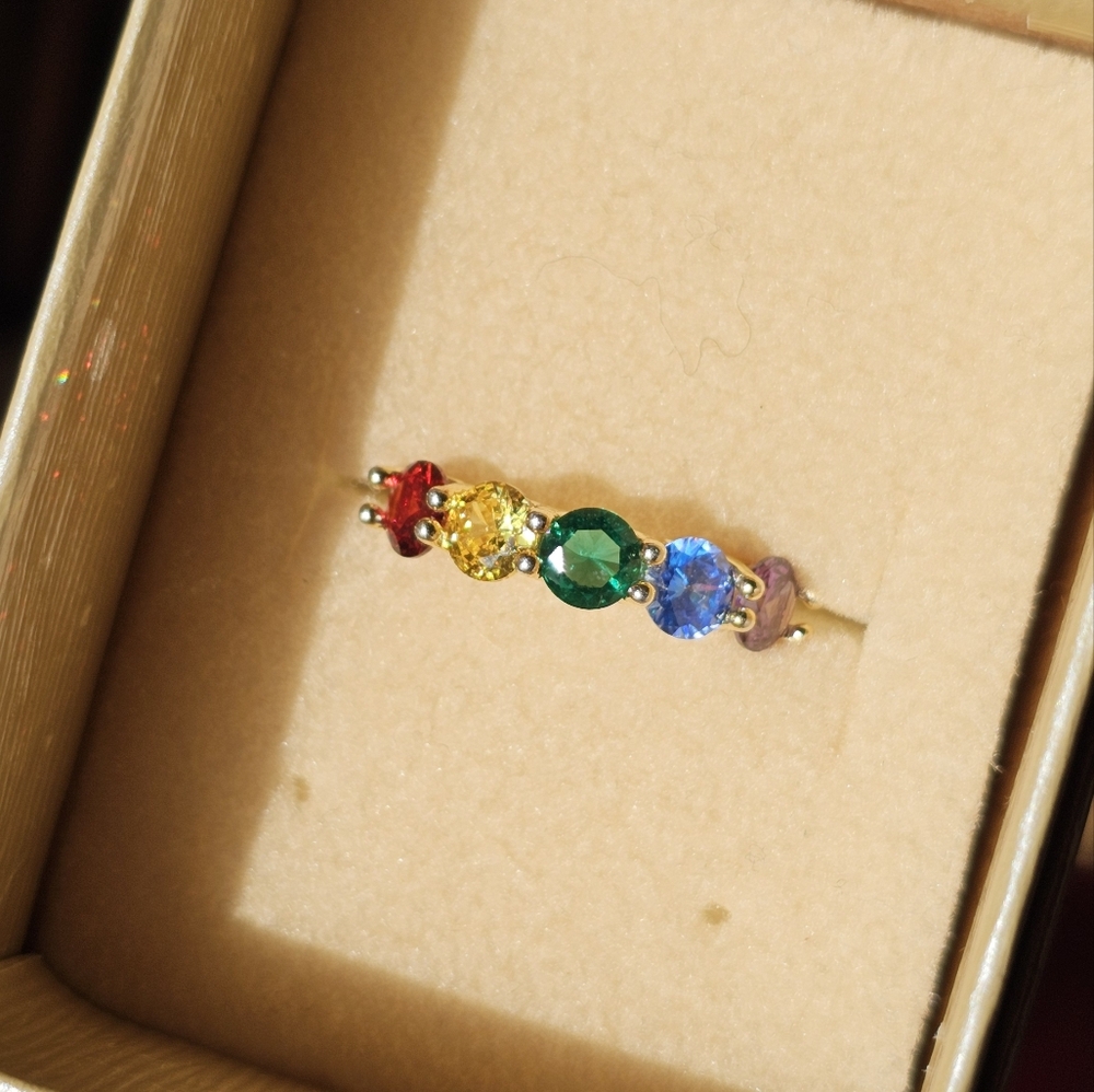 Sterling silver rainbow ring size 6 1/4. Comes in the box as pictured. Beautiful